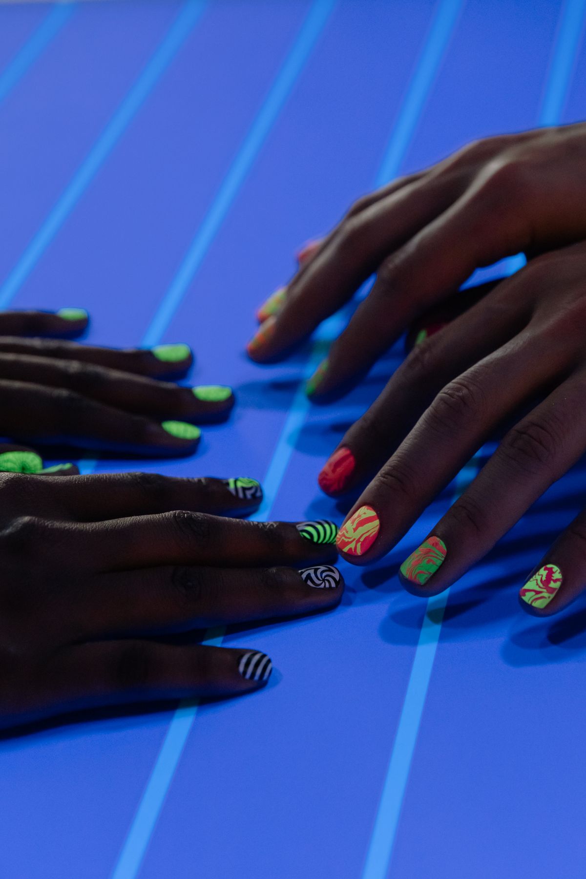 Gel jelly nail application under UV lamp showing the curing process for a sheer glossy finish