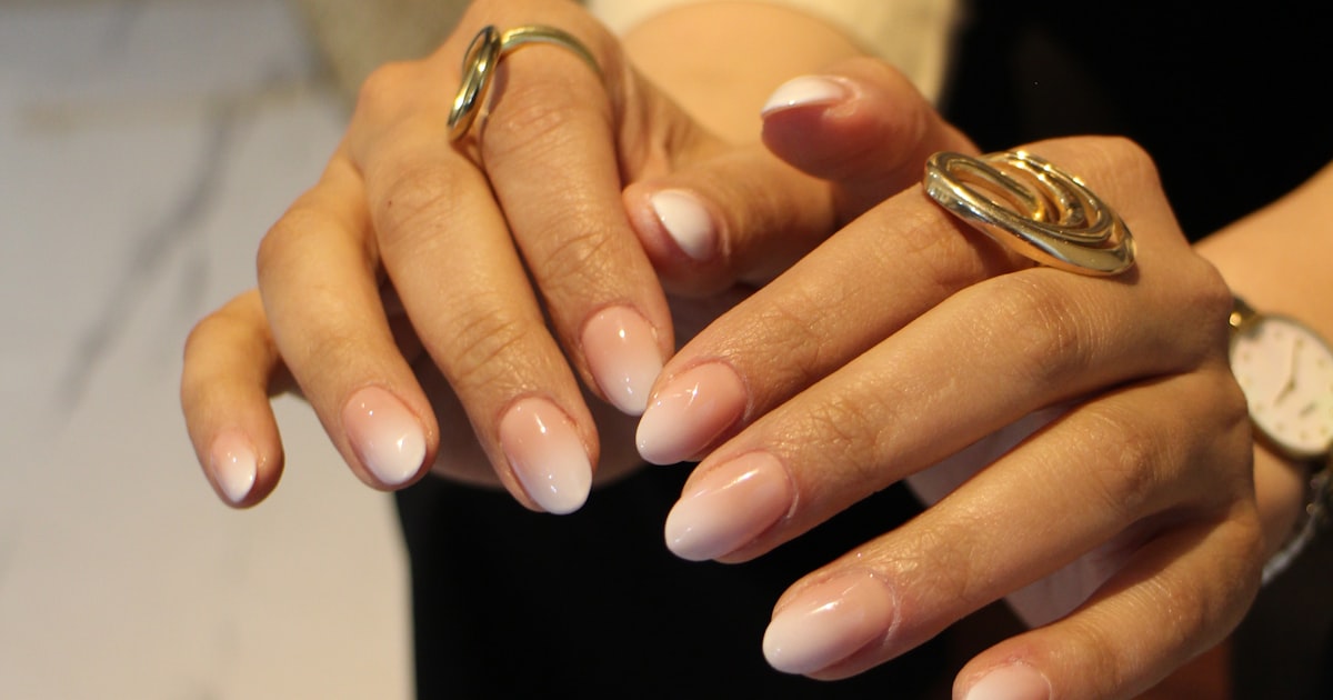 Ombre almond nails design fading from nude to white