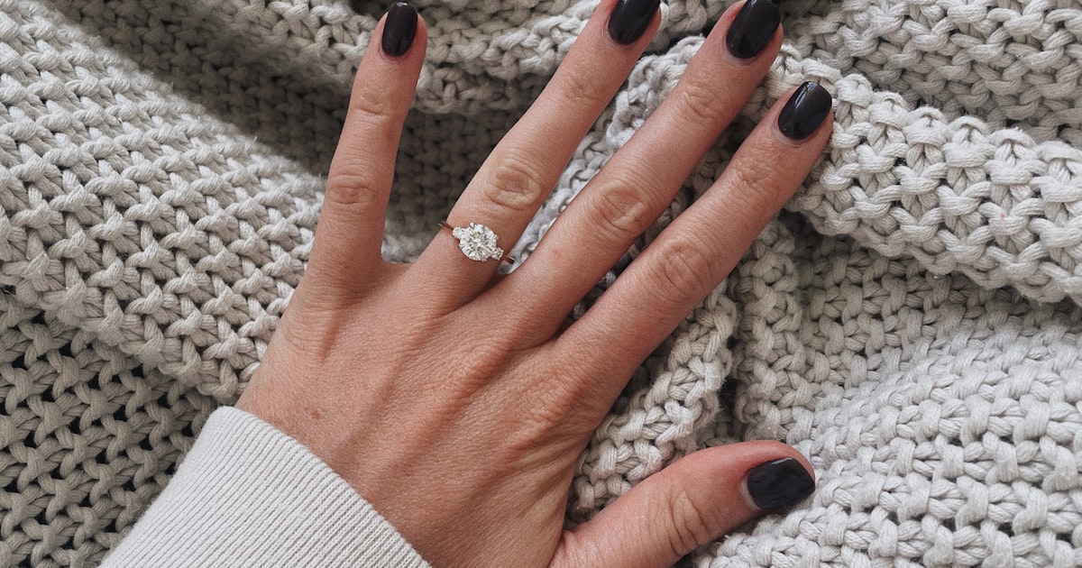 Black and white nail designs featuring a monochrome reverse French manicure
