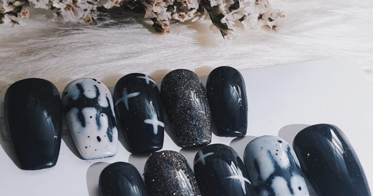 Black and white nail designs 2026: a set of monochrome manicures on a table