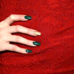 Christmas nails 2026 with a festive green polish shown on a hand