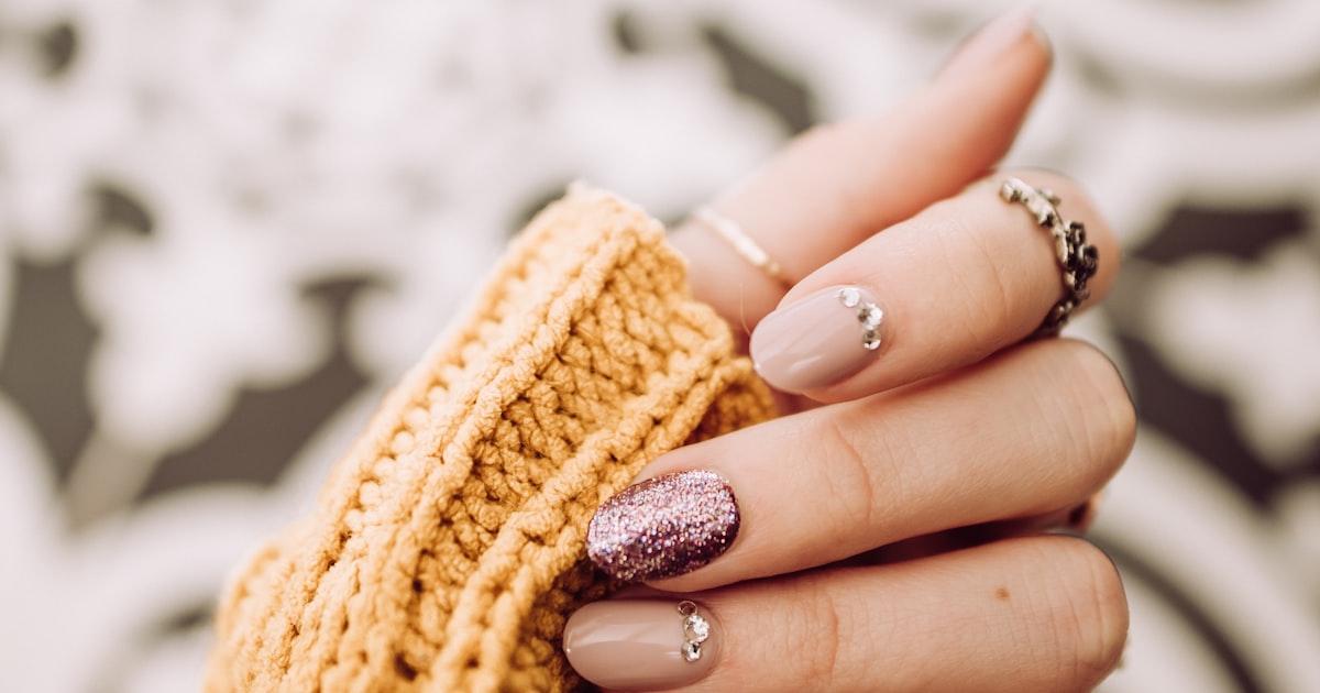Minimal diamond nails styled with a silver diamond ring