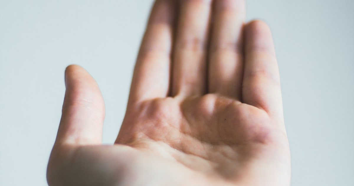 Hand shown with soft milky white nail finish
