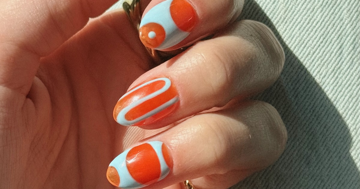 Orange nail colors in abstract art: light blue and orange patterned manicure