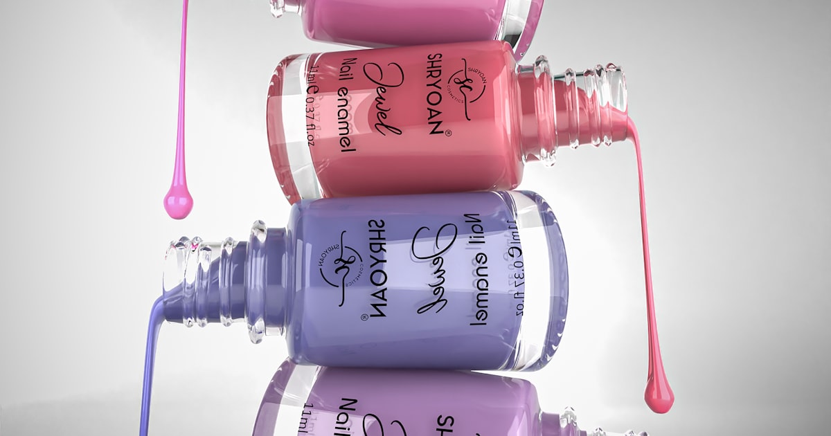 Bottles of red nail polish, dripping color