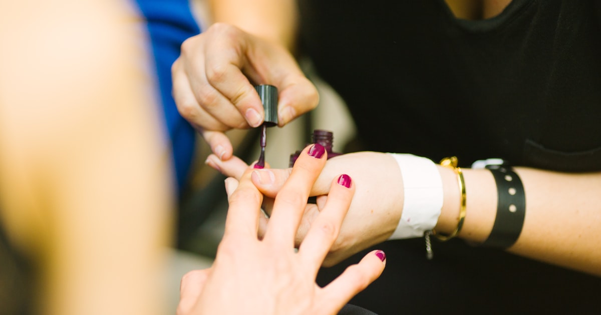 Applying red polish at home, a budget-friendly route to trendy nail designs