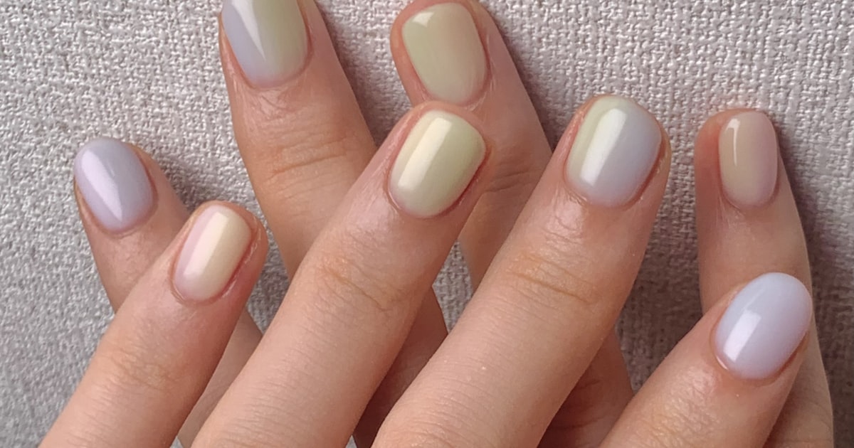 Nude nails shown displaying a ring on the finger