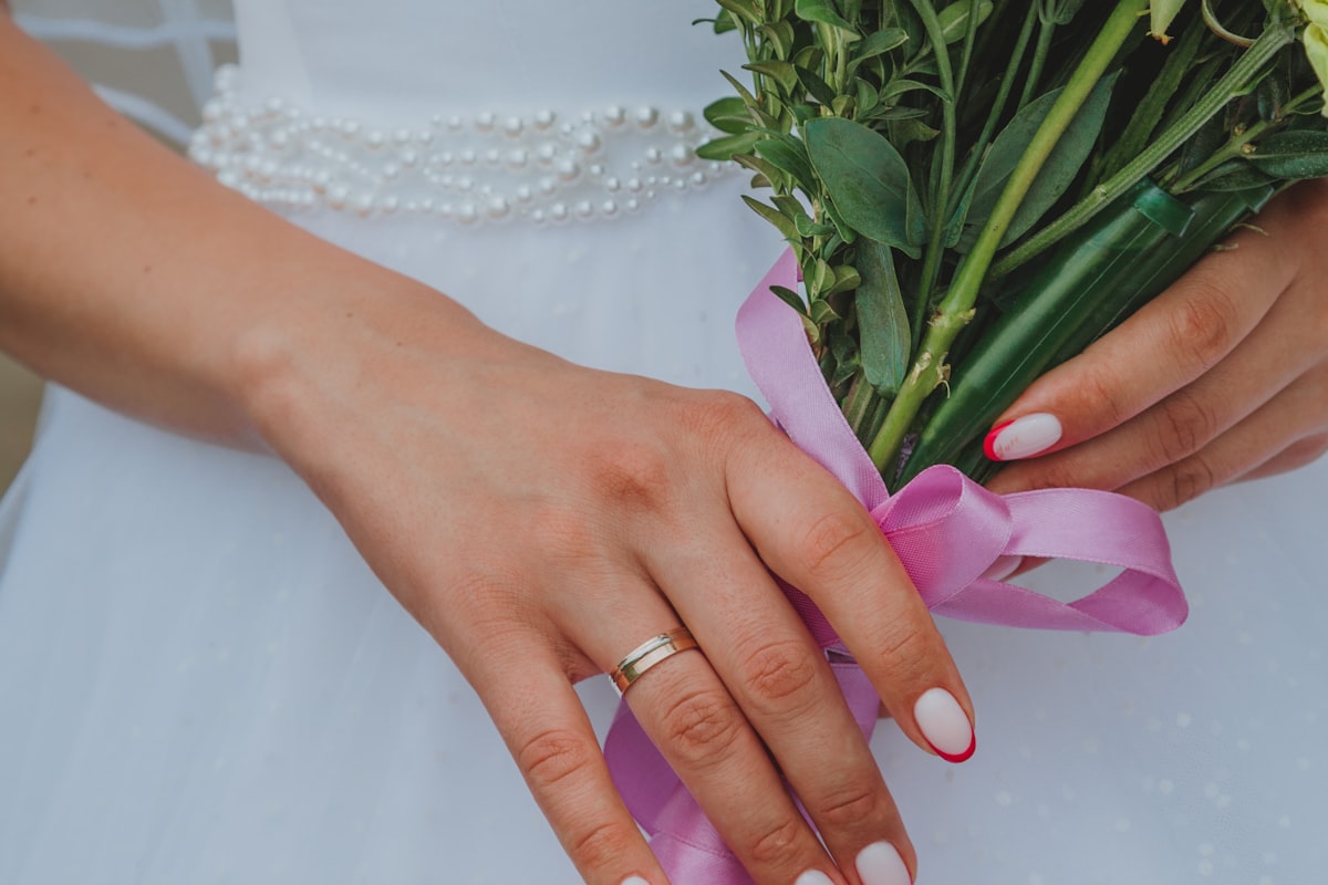 senior photo nails — soft pink almond manicure catching light