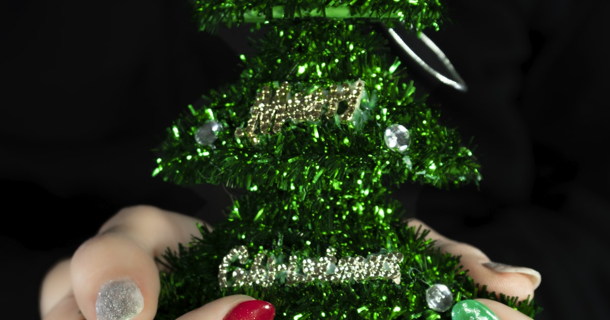 Christmas nails 2026 shown with evergreen holiday decoration